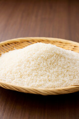 Serving raw Japanese rice in a bamboo sieve
