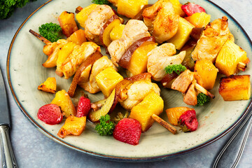 Grilled chicken on bamboo skewers.