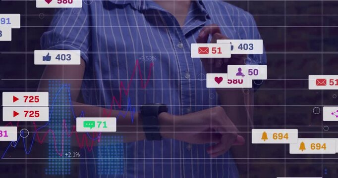 User tapping smartwatch in front of dark brick wall, showing floating line graphs and social icons