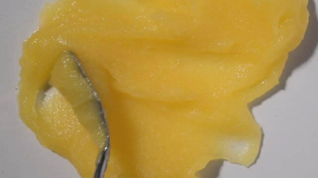 Abstract yellow sugar body exfoliating scrub texture. Melon scrub for body or face pilling. Skin care body moisturizer scrub background.