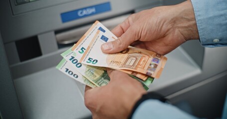 Close Up of Unrecognizable Man, Businessman Counting Euro Bills in Hands After Withdrawing Cash...