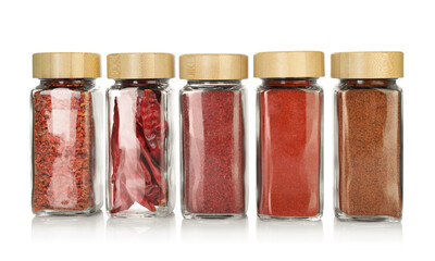 Many different aromatic spices in jars isolated on white