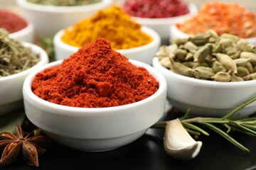 Many different aromatic spices on table, closeup