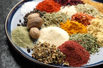 Many different aromatic spices on table, closeup