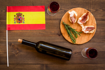 Sliced jamon on cutting board. Parma ham with wine. Traditional Spanish meal
