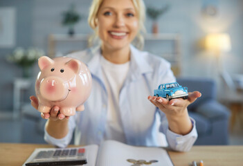 Piggy bank and toy car, happy woman planning counting to save money, motivated for result,...