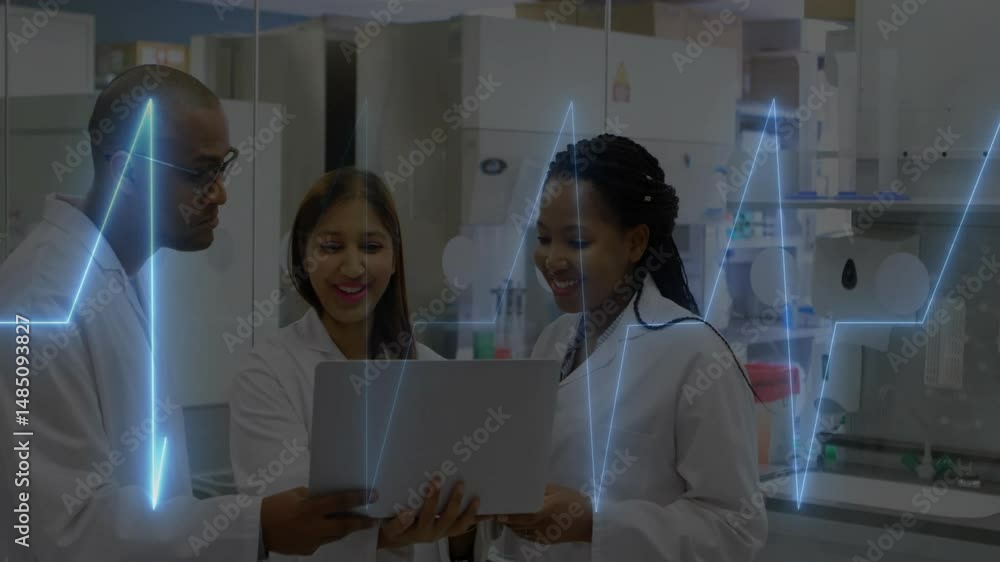 Poster three technicians standing around laptop in modern lab, with animated data graphs floating