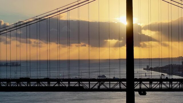 Sunset Sky Over 25 Of April Bridge At Lisbon In Lisbon District Portugal. Sunset Downtown. Freeway Road Landscape. 25 Of April Bridge At Lisbon In Portugal. Railroad Scenery.
