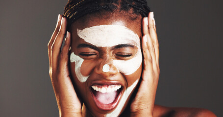 Excited, skincare and clay mask with black woman in studio for facial, spa results success or...