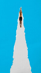 Male swimmer dives with arms forward through torn paper stripe against blue background. Textured scrap design. Contemporary collage. Concept of sport, competition, performance, strength