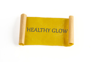 A yellow scroll with the phrase healthy glow is prominently displayed. This serving as a vibrant...