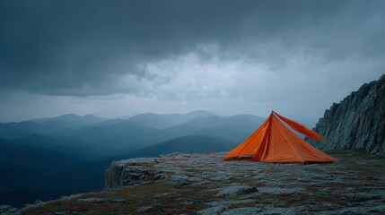A waterproof tent braves fierce winds on a mountain ledge, fabric flapping against a stormy sky. Perfect for extreme camping and outdoor adventures in harsh weather.