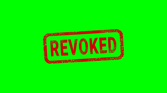 Appearance of a dirty red stamp mark "REVOKED" surrounded by a rounded frame  from above on a green screen with alpha channel