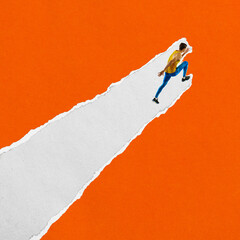 Fototapeta na wymiar Male runner in yellow top and blue tights runs upward on diagonal torn paper stripe against orange background. Textured scrap collage. Concept of sport, race, speed, agility, energy. Contemporary art