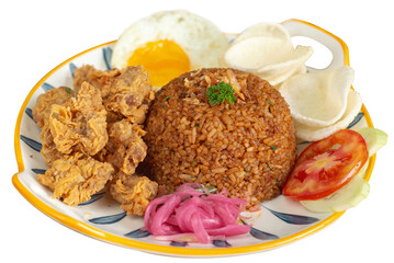 Traditional fried rice with chicken popcorn as topping. Served with sunny side up, crackers, shallots pickle and sliced tomatos. Perfect for menu, advertising or commercial use. Isolated photo