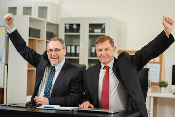 Successful confident mature businessman leader looking at camera in office.