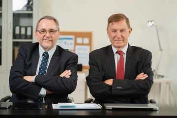 Successful confident mature businessman leader looking at camera in office.