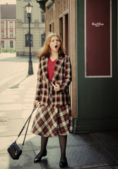 surprised агттн  woman in vintage suit in european city