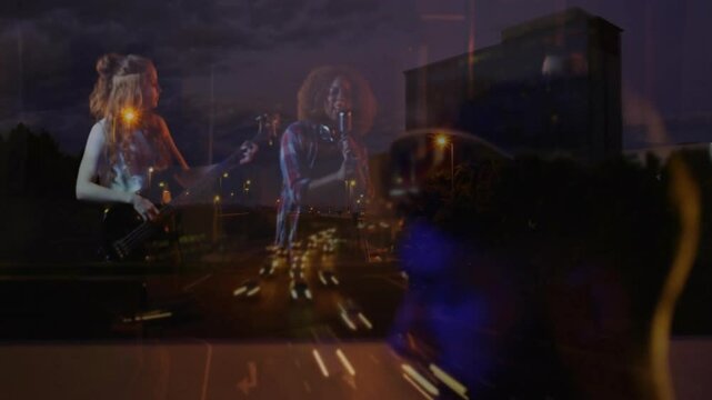 bandmates playing bass guitar and singing in studio, with animated highway lights overlaying glass