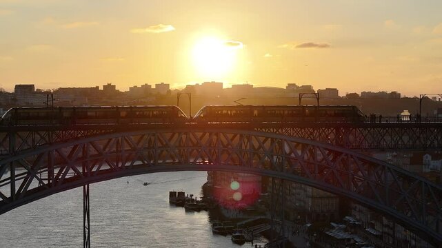 Sunset Dom Luis I Bridge At Porto In District Of Porto Portugal. Sunset Skyline Scene. Illuminated Bridge Landscape. Dom Luis I Bridge At District Of Porto Portugal. Railroad Transport. 