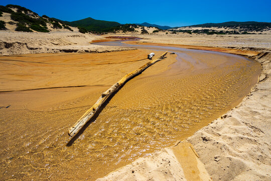 The heavily polluted Irvi River, which carries highly toxic heavy metals from the abandoned Montevecchio mine to the Spiaggia di Piscinas beach, Sardinia, Italy