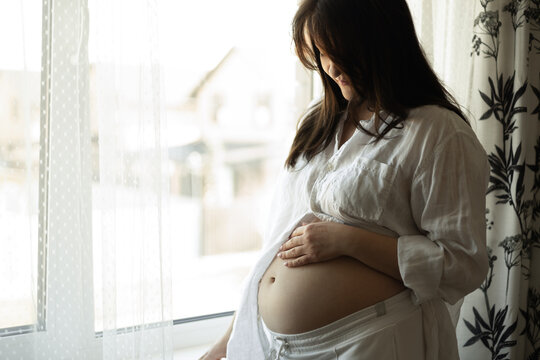 Pregnant woman preparing for upcoming motherhood