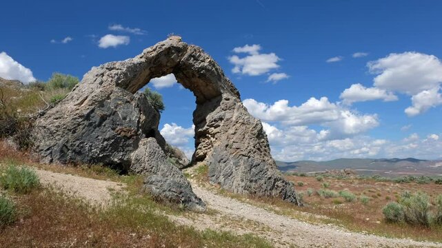 The Chinese Arch in Utah near the Golden spike historic site .  .The arch pays homage to the thousands of Chinese workers who helped build the American transcontinental railroad.	