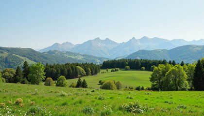 Naklejka premium Scenic landscape with mountains and green meadows under blue sky 