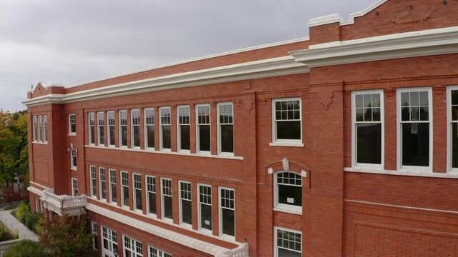 Aerial: Drone Upward Shot Of 1912 Community Center In Town - Moscow, Idaho