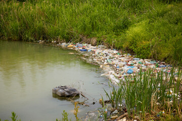 A lake polluted with garbage and plastic debris.