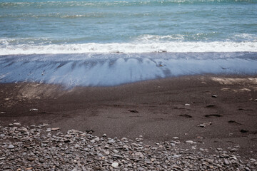 Explore black sand and clear waves at Stockeros Beach, Fuerteventura