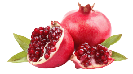 Whole red pomegranate and two halves with seeds on a white background with green leaves in view on transparent background