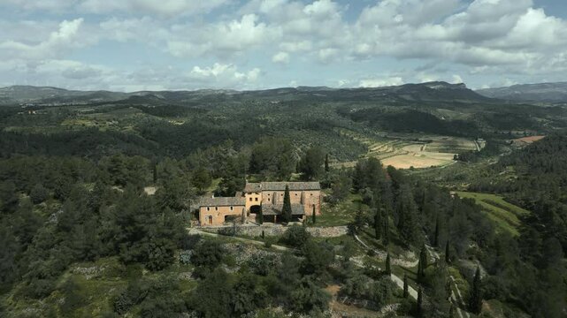 Picturesque views of the catalan hermitage of mare de deu de pinyeres nestled in the serene landscape of el priorat, catalonia, showcasing the tranquility and beauty of the region