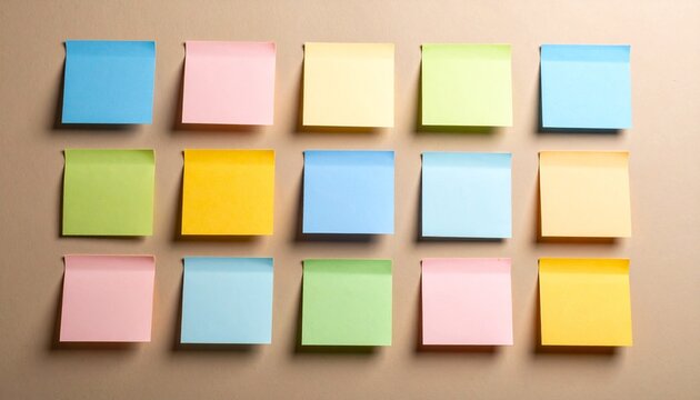 Colorful sticky notes arranged in a grid pattern on a neutral background, perfect for notes, reminders, and organization.