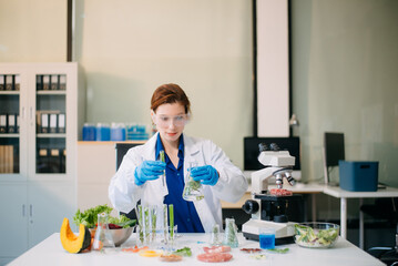 Scientist analyzing food samples in modern lab with advanced equipment for safety, nutrition, and biotechnology research.