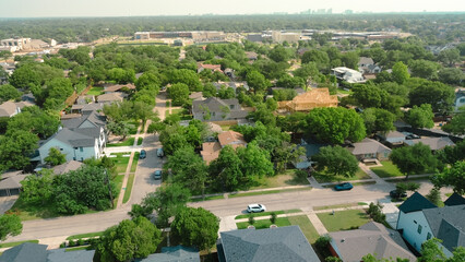 Midtown Dallas skylines from lush greenery affluent neighborhood luxurious homes, amenities, pools,...
