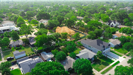 Lush greenery affluent neighborhood with luxurious homes, amenities, pools and two-story wooden...