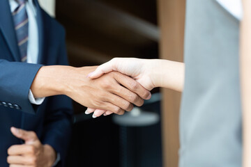 Fototapeta premium Handshake Agreement. Two professionals sealing a deal with a handshake.