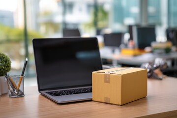 Laptop and package on modern office desk.