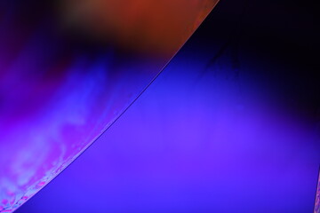 Dark purple liquid surface on black background, oil stains movement, bright chemistry, deep space...