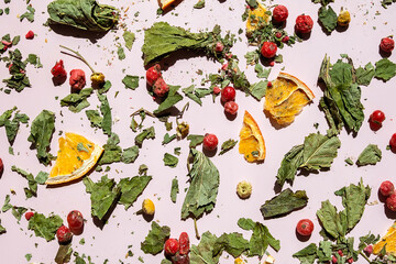 Scattered Dried Leaves, Berries and Orange Slices. Ingredients for Herbal Tea and Concept of Natural Wellness.