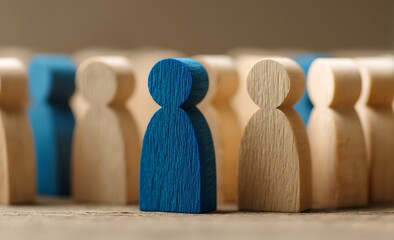 Unique Individual Standing Out Among a Crowd of Wooden Figures
