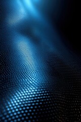 Close-up of a textured surface with small hexagonal patterns illuminated by blue light creating a flowing, wave-like effect