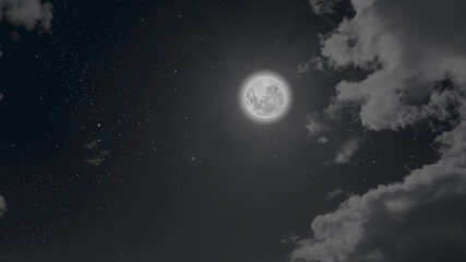a moon moving in the night sky with stars and clouds