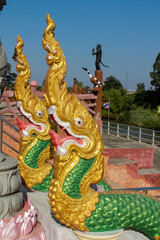 Fototapeta premium Description Colorful dragon statues in interior and exterior of buddhist temple Wat in Thailand. Thai traditional religious Buddhist architecture with statues of Asian dragons decoration. Thailand tra