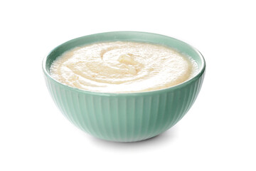Semolina in green bowl isolated on white nobody.Creamy cereal,oatmeal.