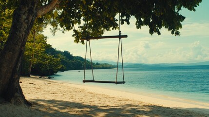 A serene beach scene featuring a wooden swing hanging from a large tree,