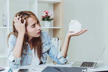 Young women teen working at business office desk stress thinking about debt house loan, home refinancing concept