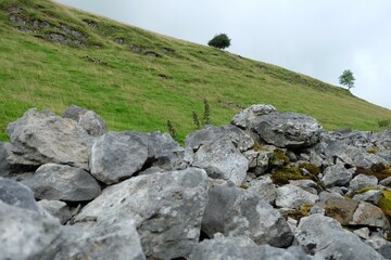 a hill with rocks and grass on it © danang