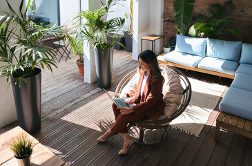 Overhead top view of busy elegant mature middle aged business woman professional leader wearing...